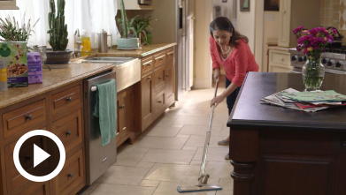 Mobility video woman cleaning kitchen floor